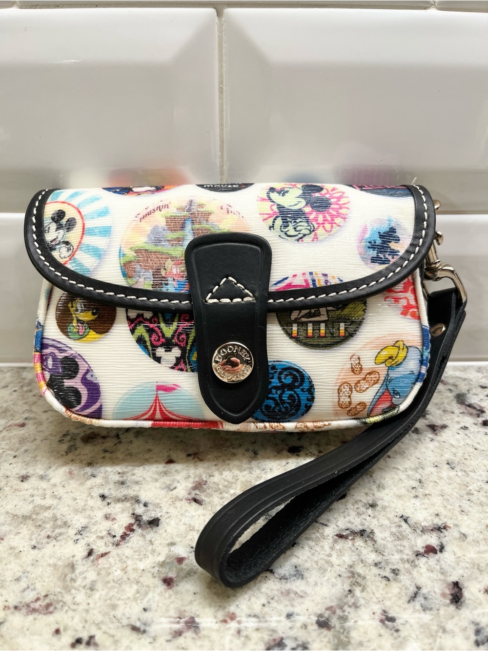 Dooney & Bourke Disney Buttons Flap Wristlet NWOT